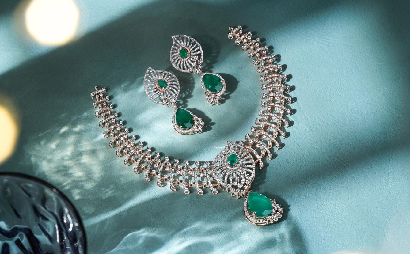 Emerald and diamond necklace set with matching earrings